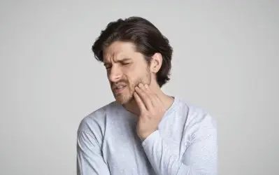 A man suffering from Toothache - Dental Emergency