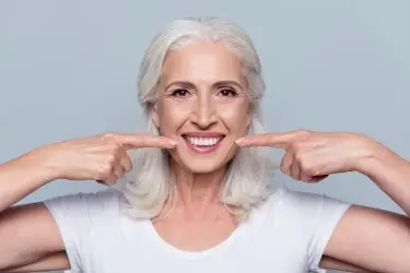 Aging woman after Dental Implants