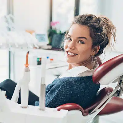 Girl sitting on the chair for dental treatment