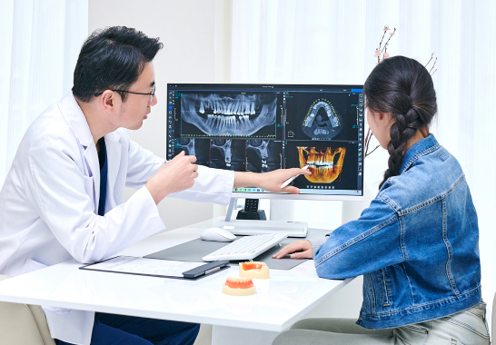 Asian Dentist and Female Patient Discussing at Dental Office