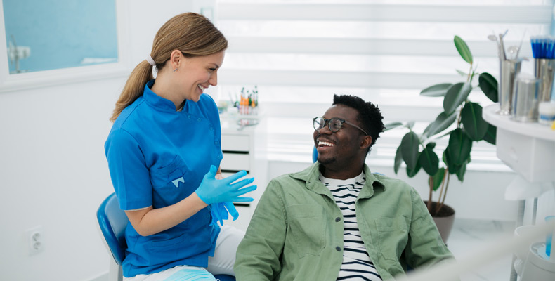 Patient sitting with dentist