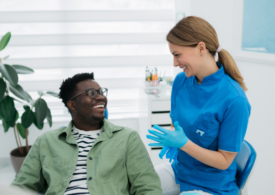Patient sitting with dentist