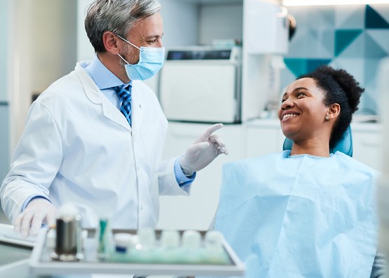 dentist with smiling patient