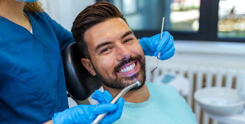 dentist examining mans smile