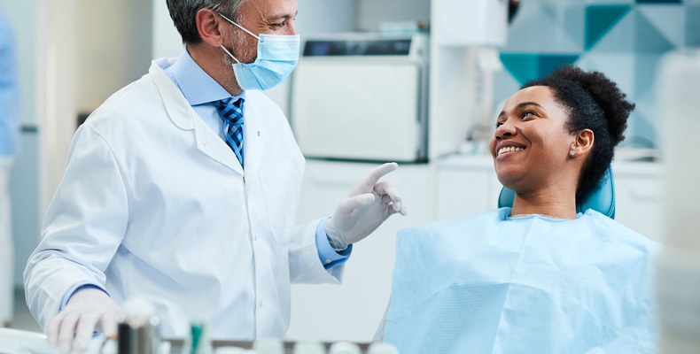 dentist with smiling patient